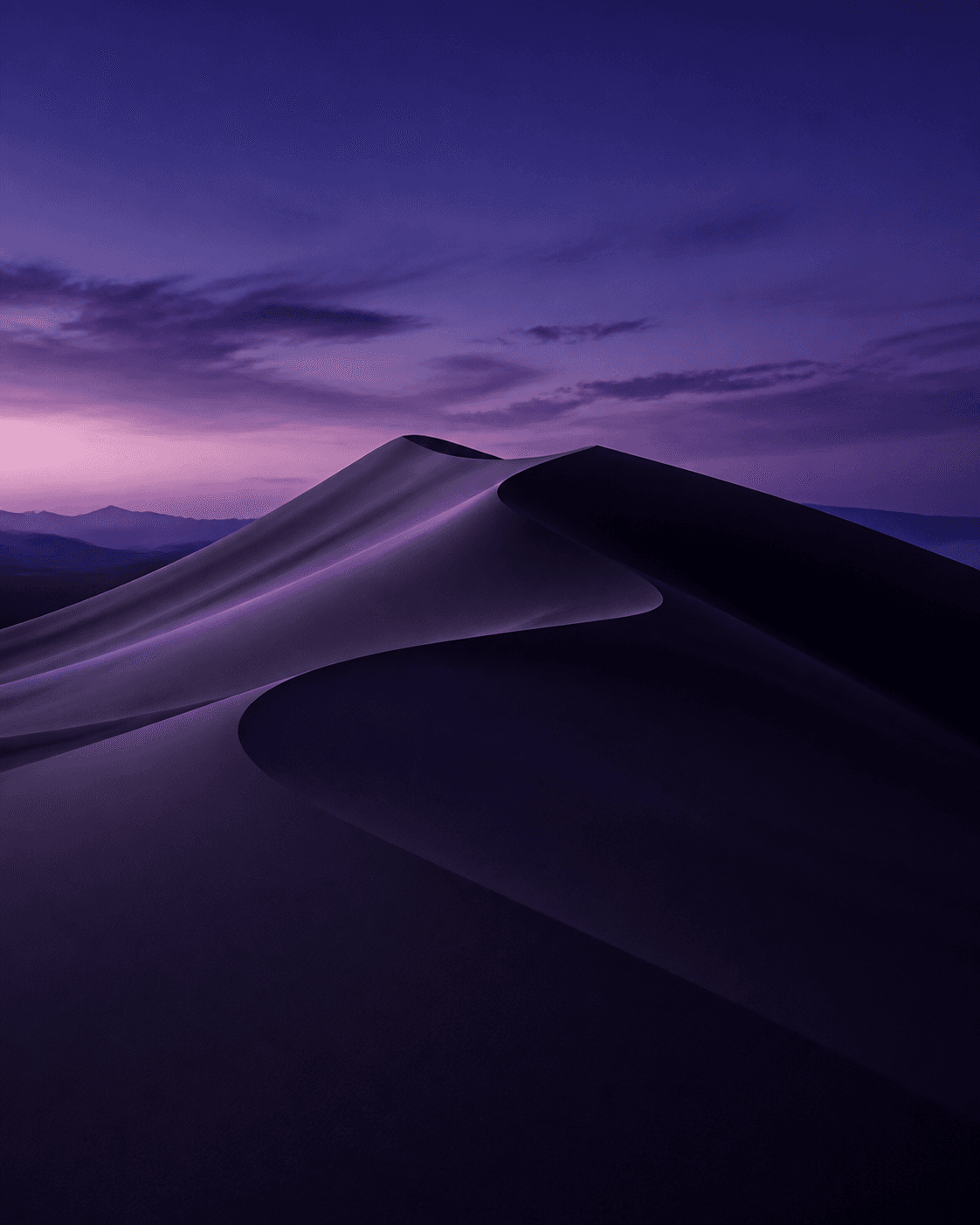 Purple dunes beneath a twilight sky